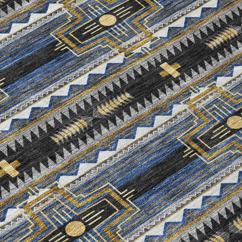 Tribal area rug close-up: black and blue stripes with gold dots and zigzag trim