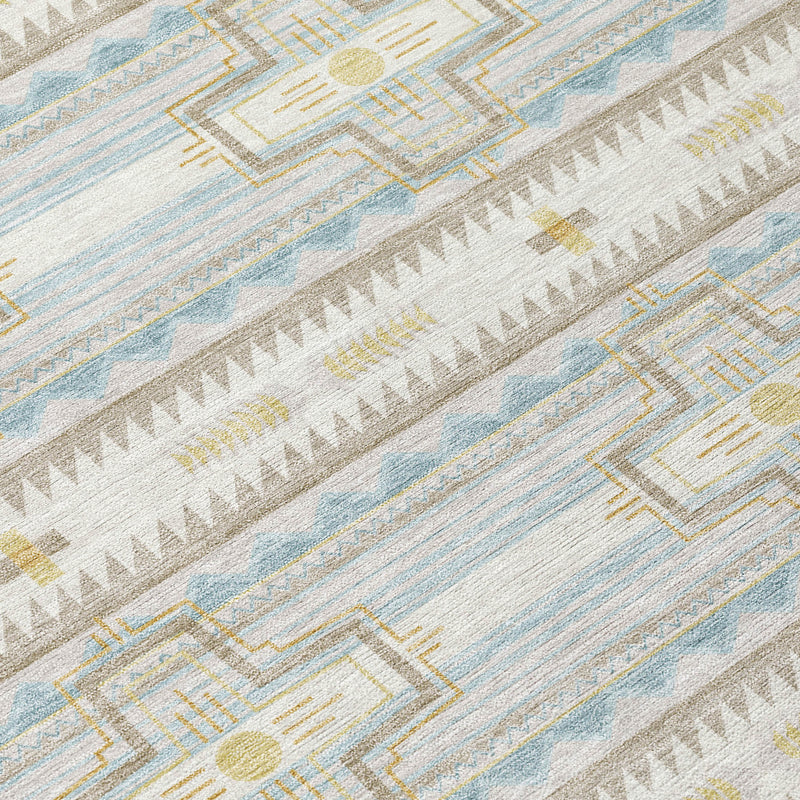Close-up of ivory and cream rug with blue stripes and geometric cross details