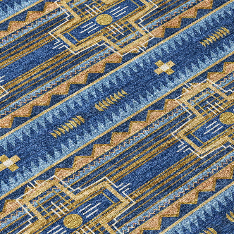 Close-up of navy blue tribal rug with gold, tan, and blue geometric weave pattern