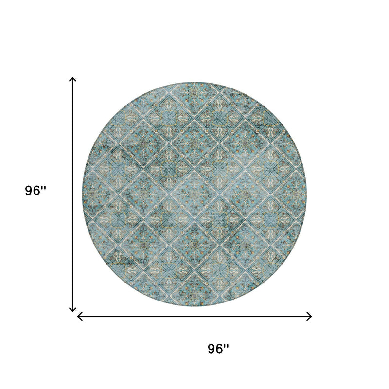 Teal round area rug with distressed diamond geometric pattern and thin border lines