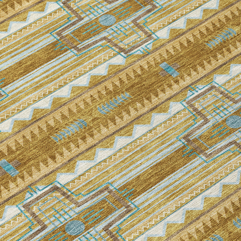 Diagonal close-up of tan area rug texture with blue patterned lines and cross shapes