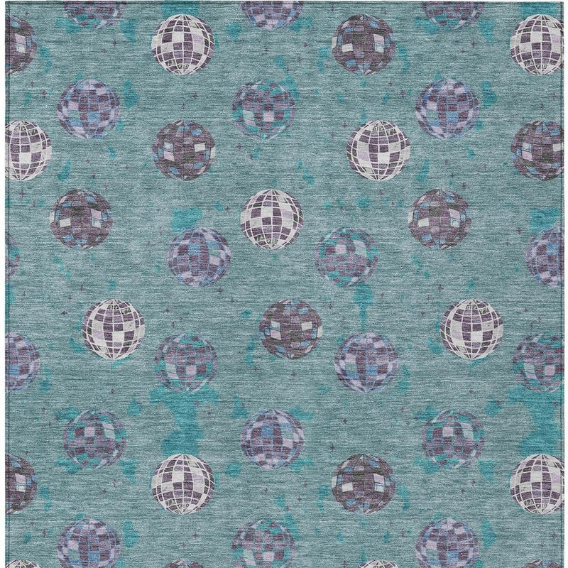 Teal blue area rug with consistent repeating purple and white geometric orb pattern