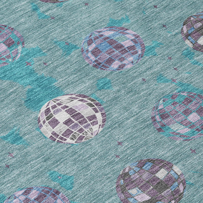 Teal blue and gray area rug with repeating purple and white geometric orb pattern