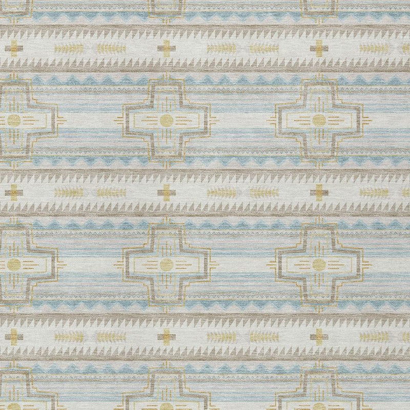 Close-up of ivory and light blue geometric cross pattern on an indoor outdoor rug