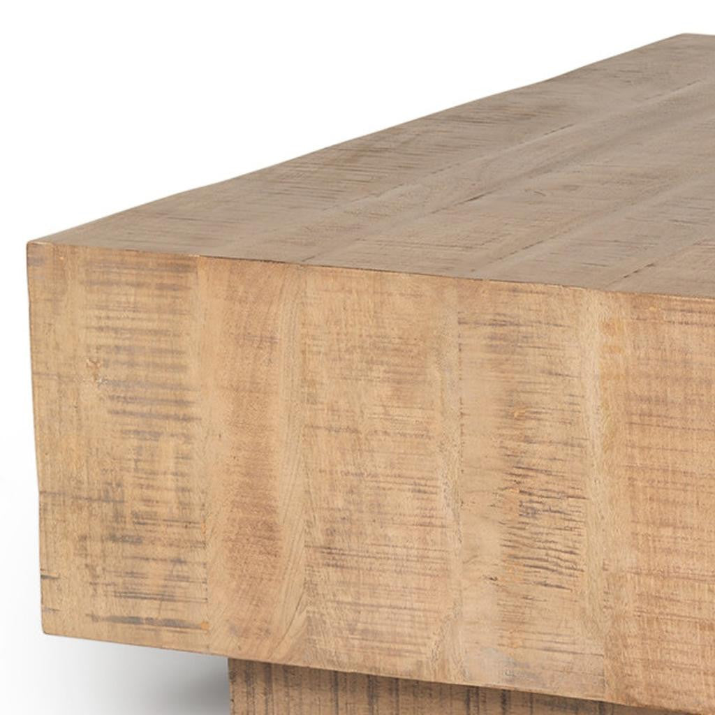 Close-up of natural wood grain on a square block coffee table top