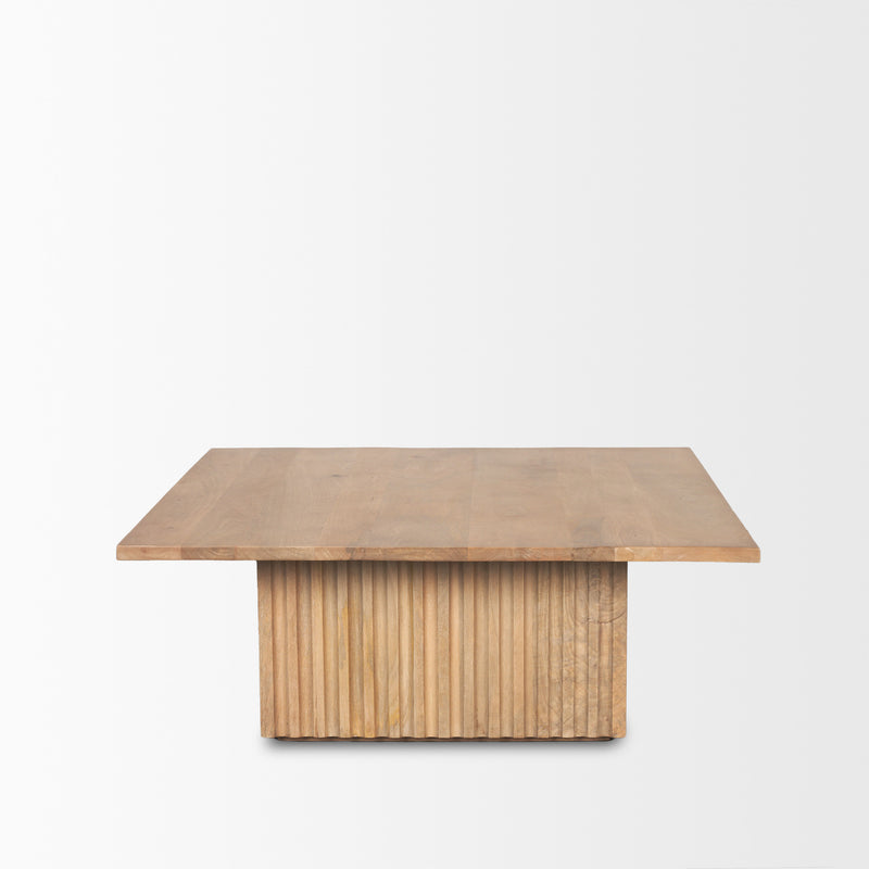 Square solid wood coffee table, light brown, shown front view with slatted apron