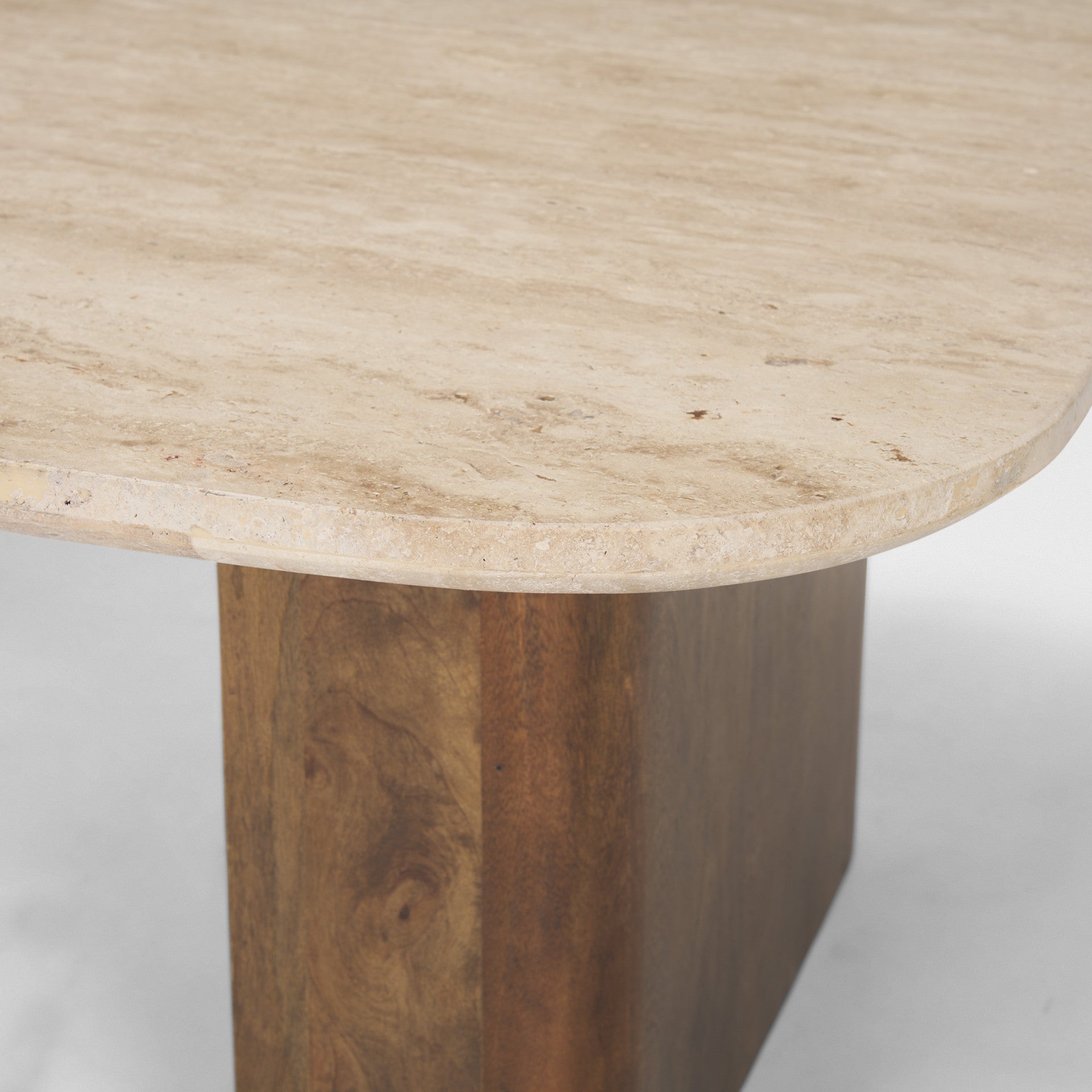 Beige stone coffee table top with speckled texture and brown wood pedestal base
