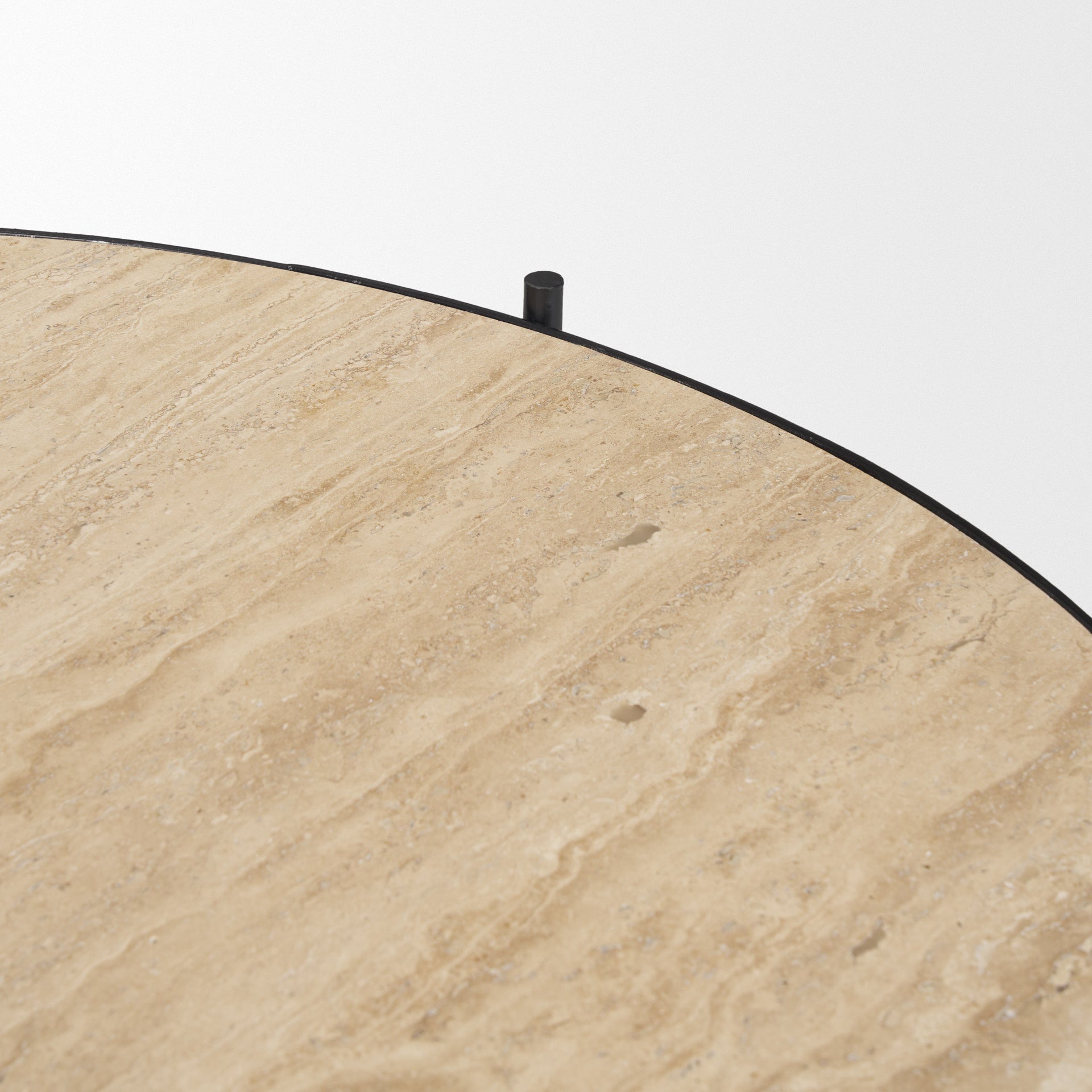 Beige stone-look tabletop surface with black rim and small metal fasteners