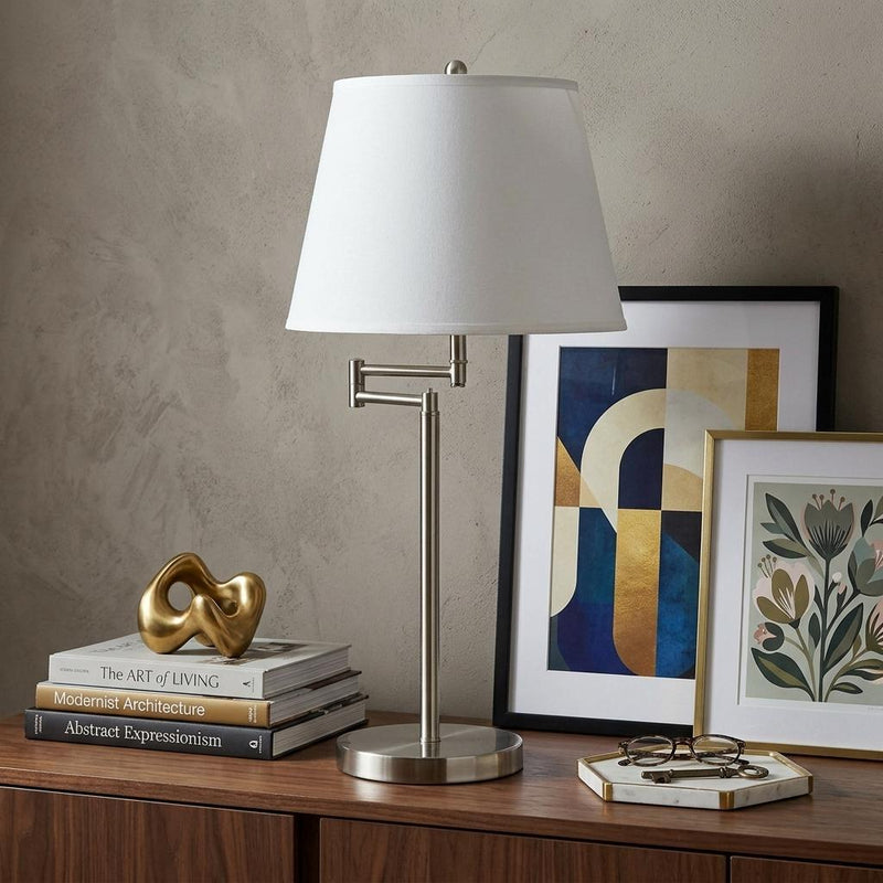 Nickel table lamp with off-white empire shade and adjustable arm detail