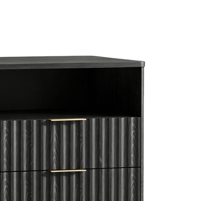 Black nightstand with top panel and ribbed drawer fronts, featuring gold bar handles