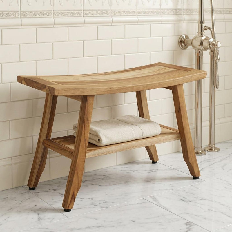 Natural teak shower bench with lower shelf, white folded towel on the seat