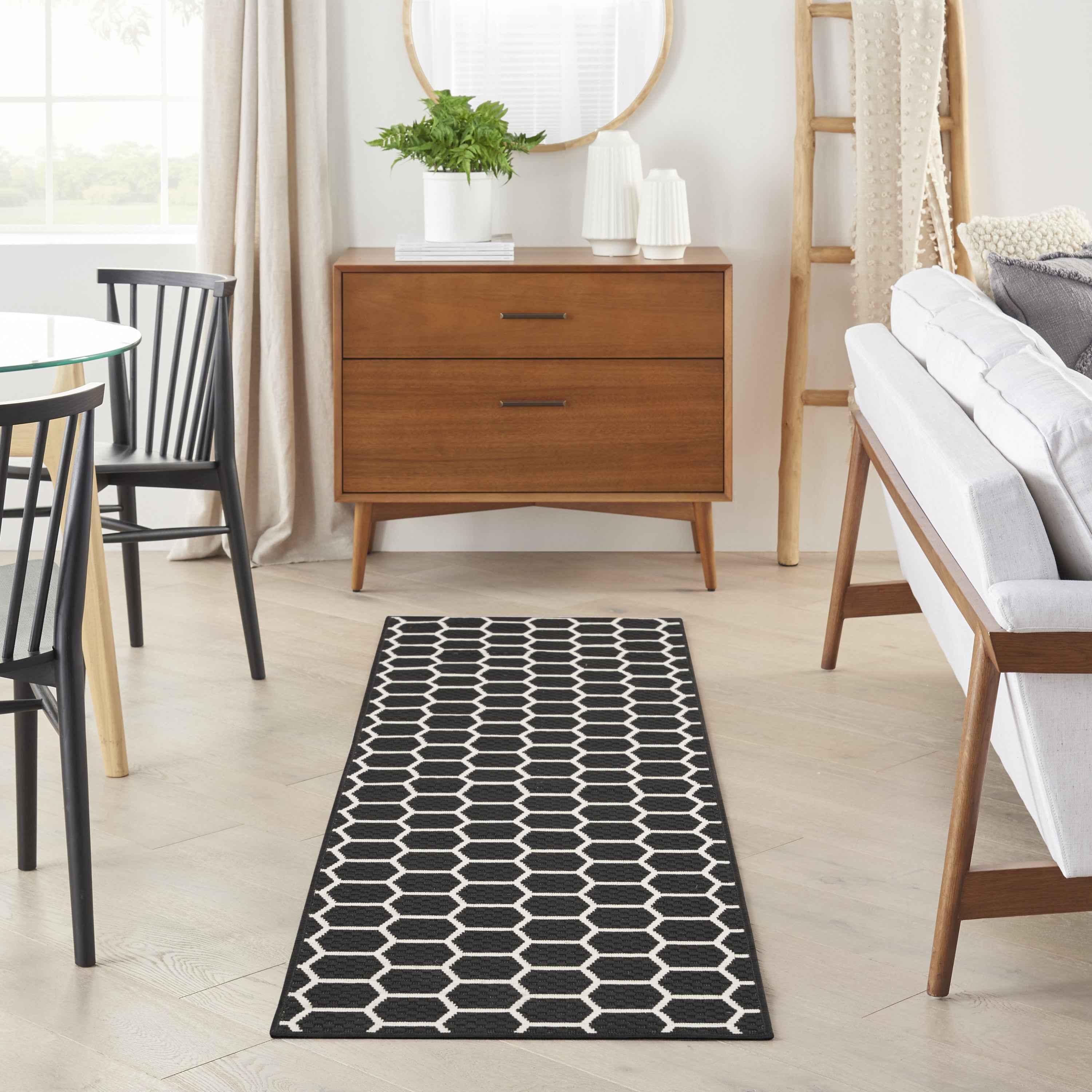 6' Black And Ivory Geometric Indoor Outdoor Area Rug