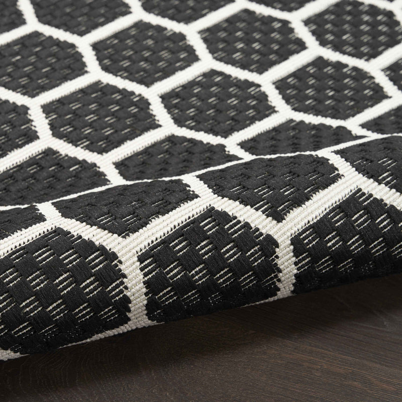 6' Black And Ivory Geometric Indoor Outdoor Area Rug