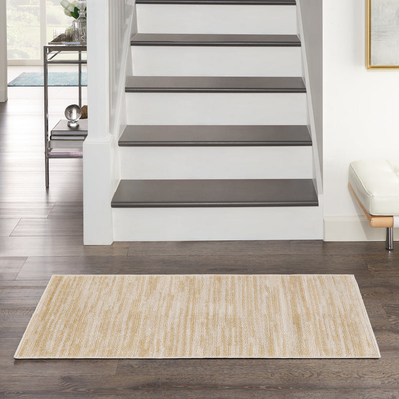 Ivory and gold abstract area rug with flatwoven texture, rectangular shape
