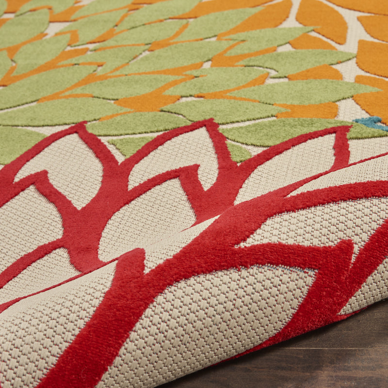 Ivory area rug with green field and bold red curved geometric floral stripes