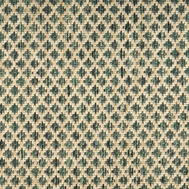 Geometric area rug with repeating green-on-beige diamond pattern across surface