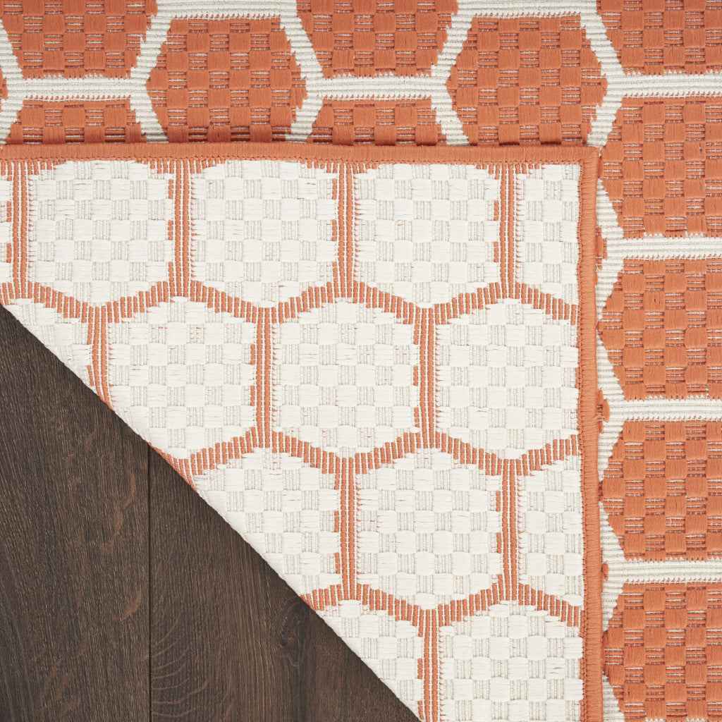 6' Coral And Ivory Geometric Indoor Outdoor Area Rug