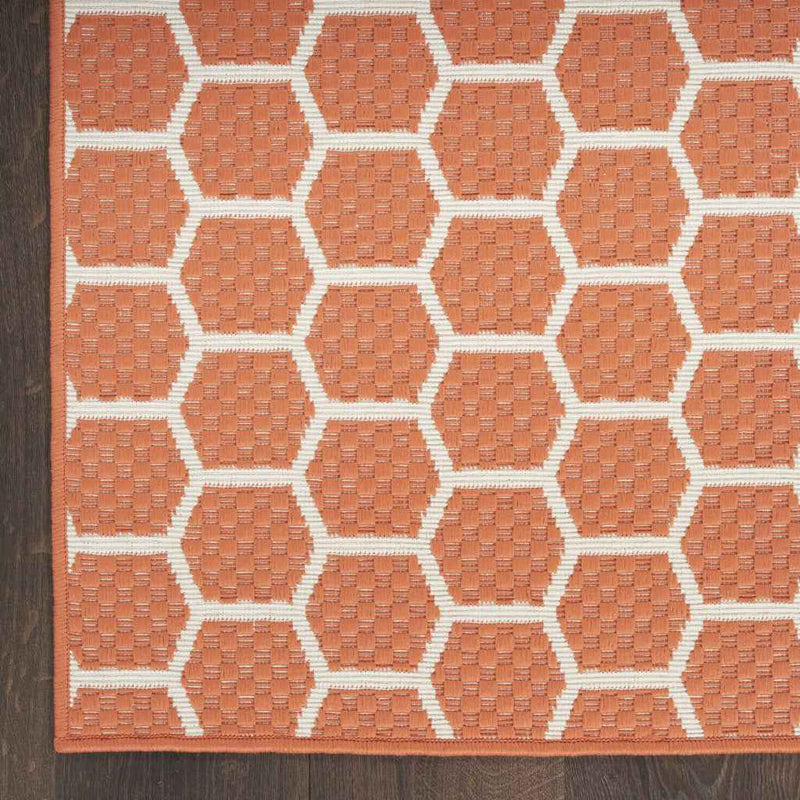 6' Coral And Ivory Geometric Indoor Outdoor Area Rug