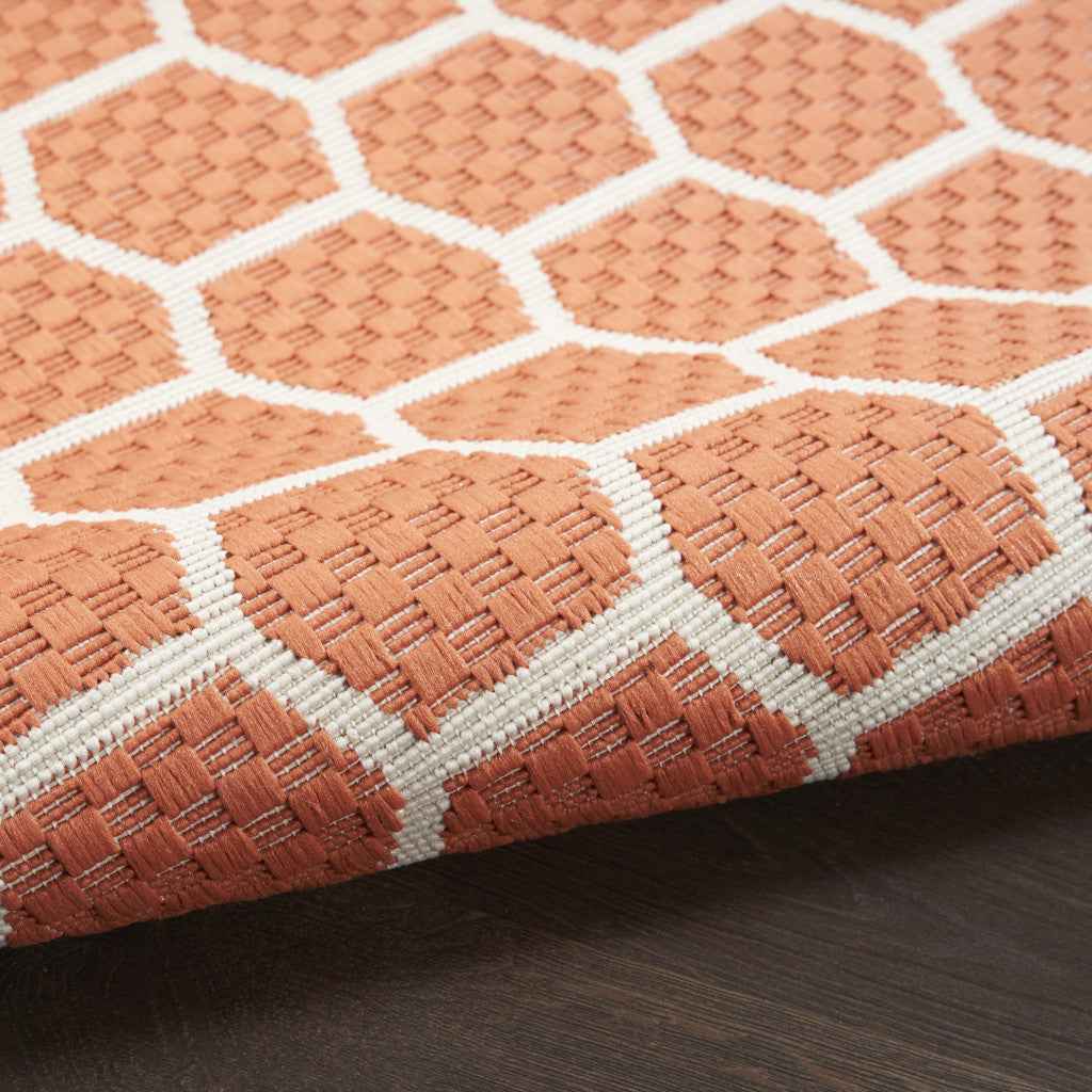 8' X 10' Coral And Ivory Geometric Indoor Outdoor Area Rug
