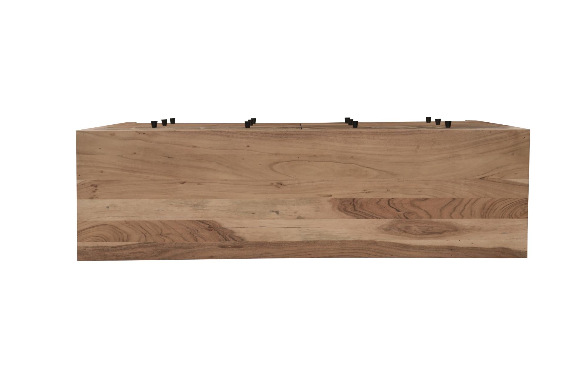 Top view of brown solid wood dresser with exposed drawer fronts and mounting hardware.