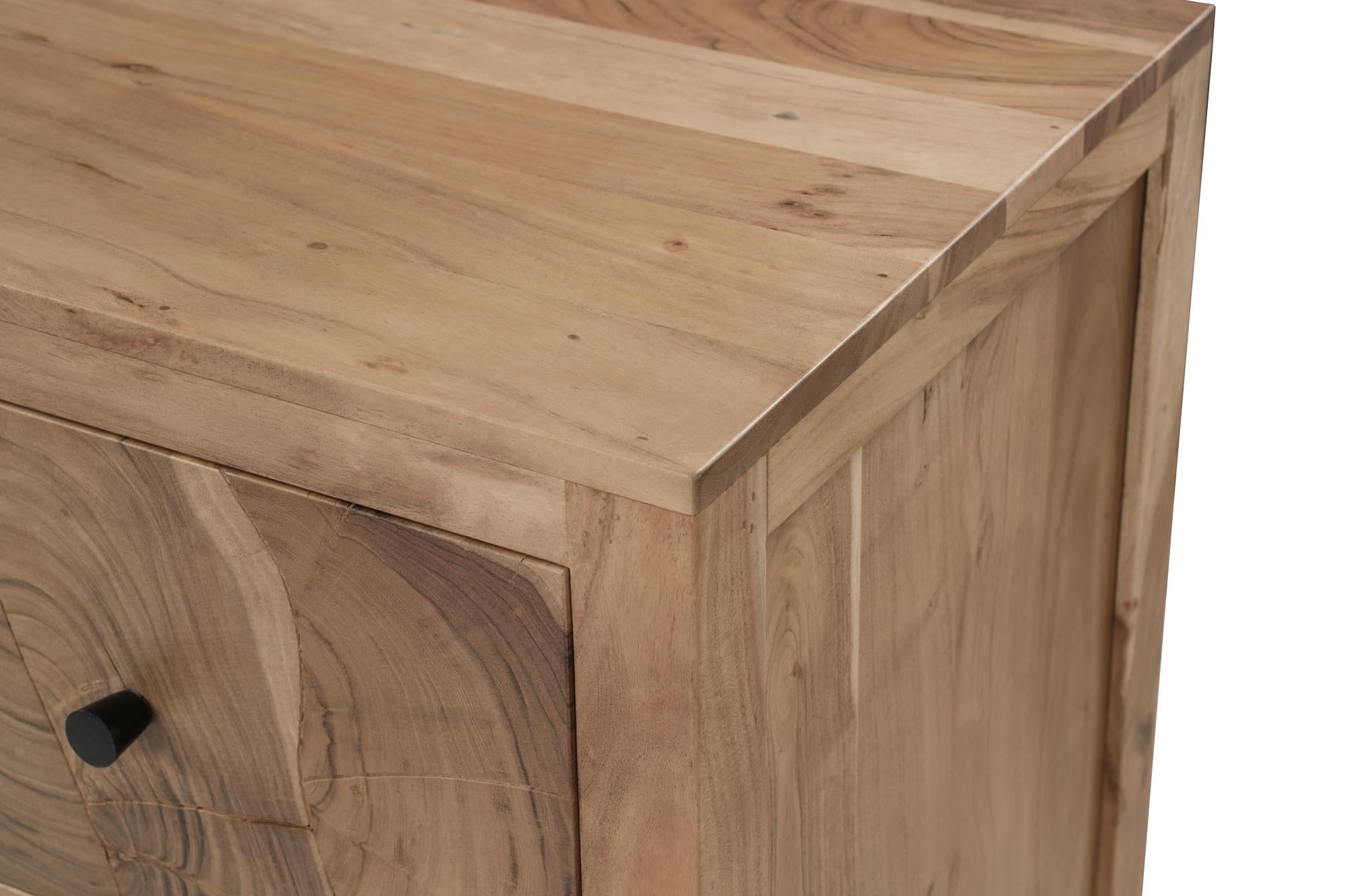 Corner close-up of brown solid wood dresser top edge with drawer seam and smooth finish.