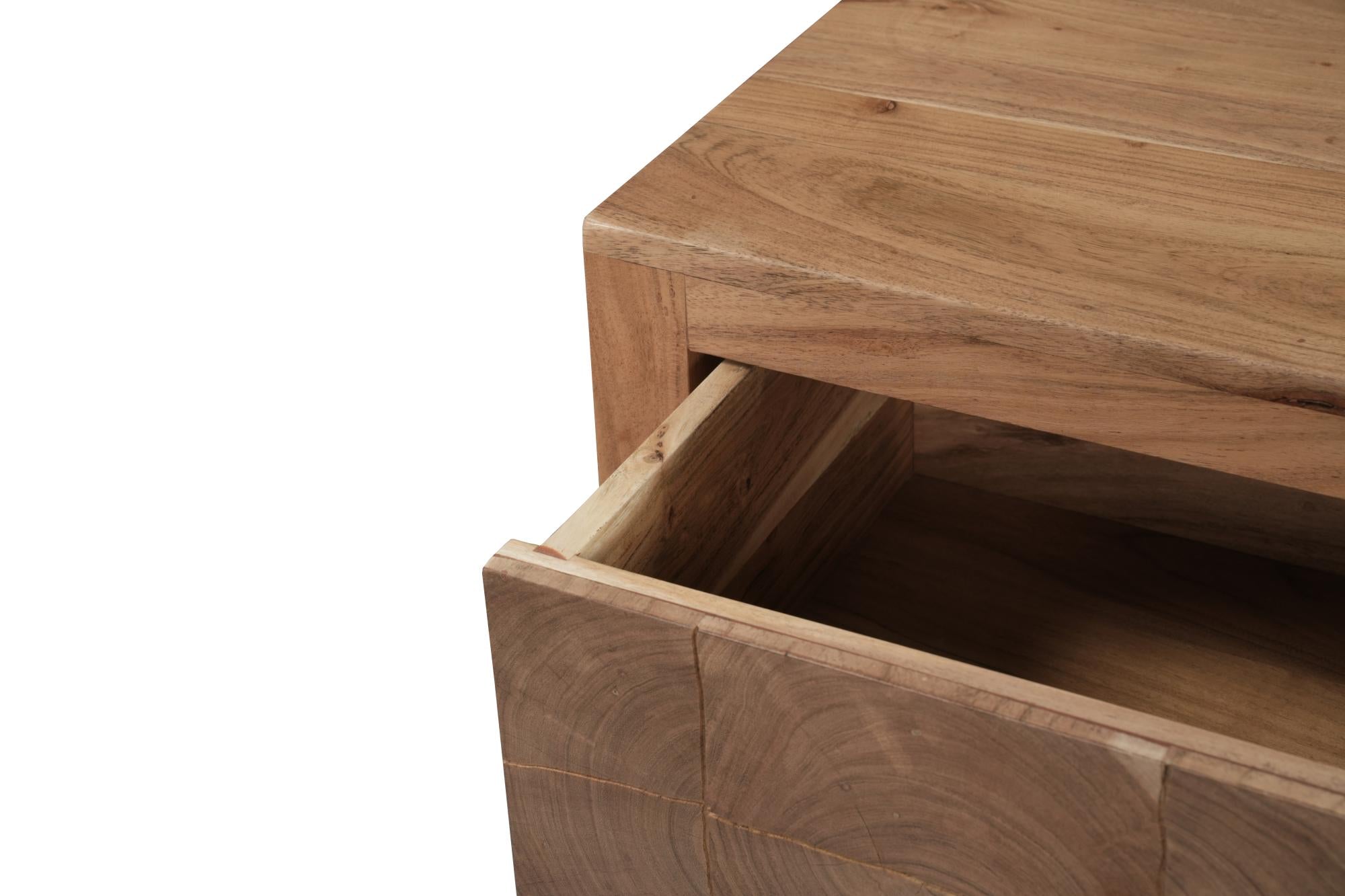 Close-up of natural wood nightstand drawer opening and interior shelf