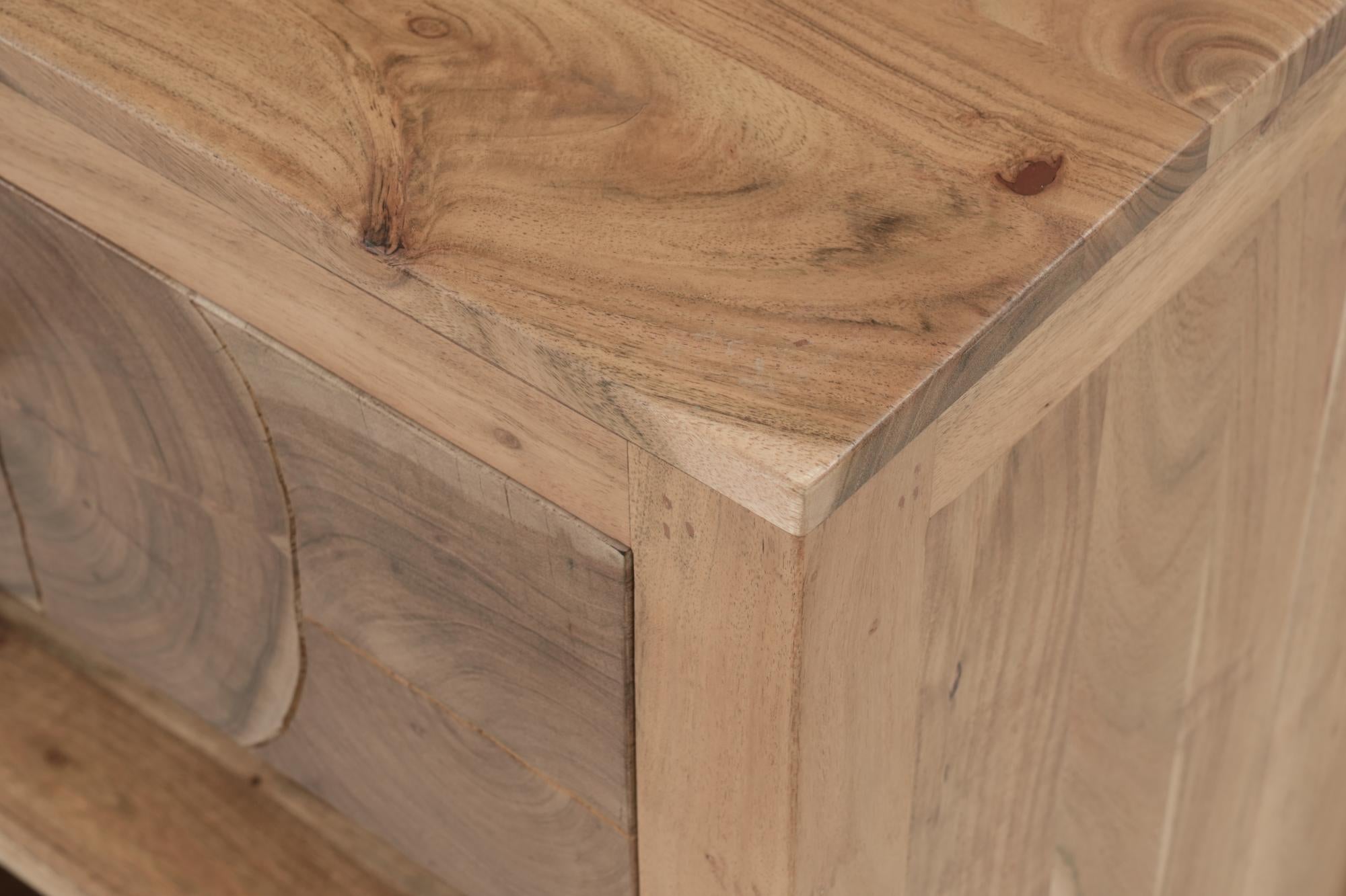 Close-up of natural wood nightstand drawer face and live-edge corner