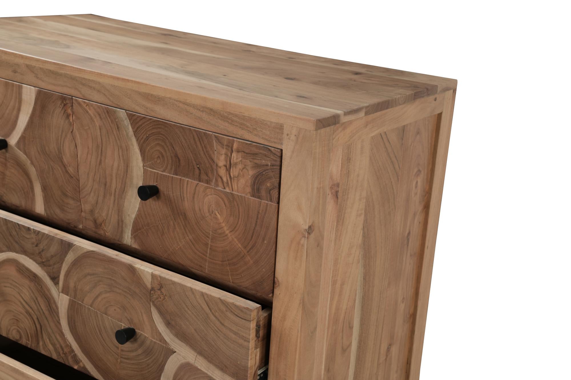 Natural wood five-drawer chest corner view with drawer fronts and black knobs.