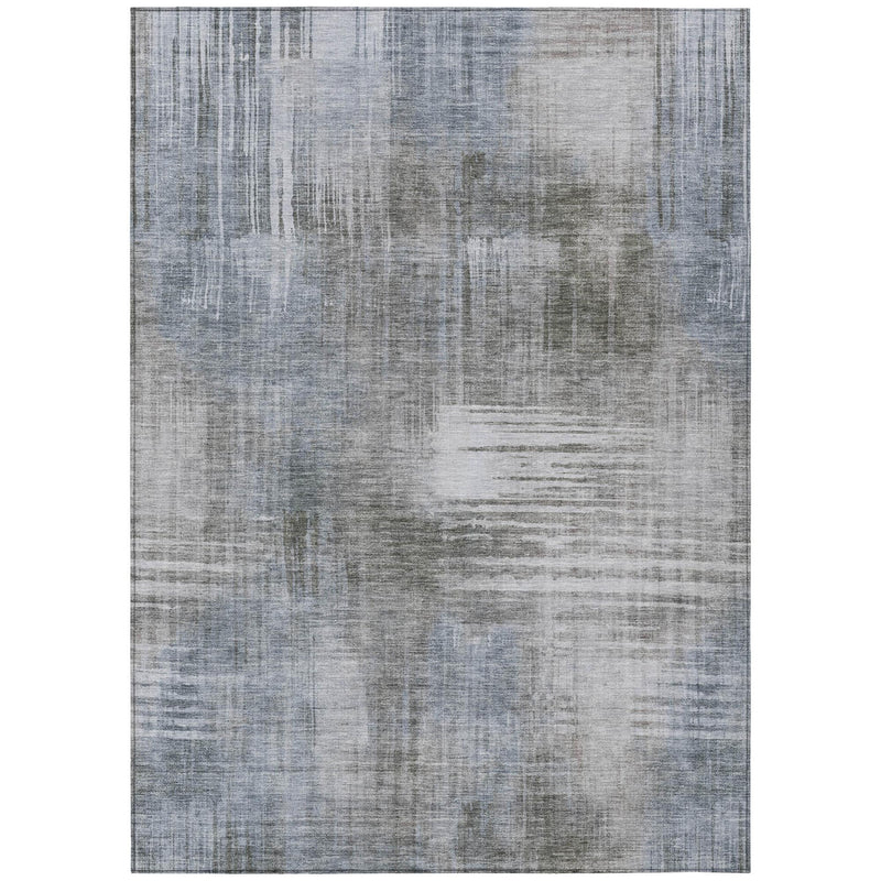 Indoor outdoor area rug featuring abstract distressed blocks in light gray and blue-gray.