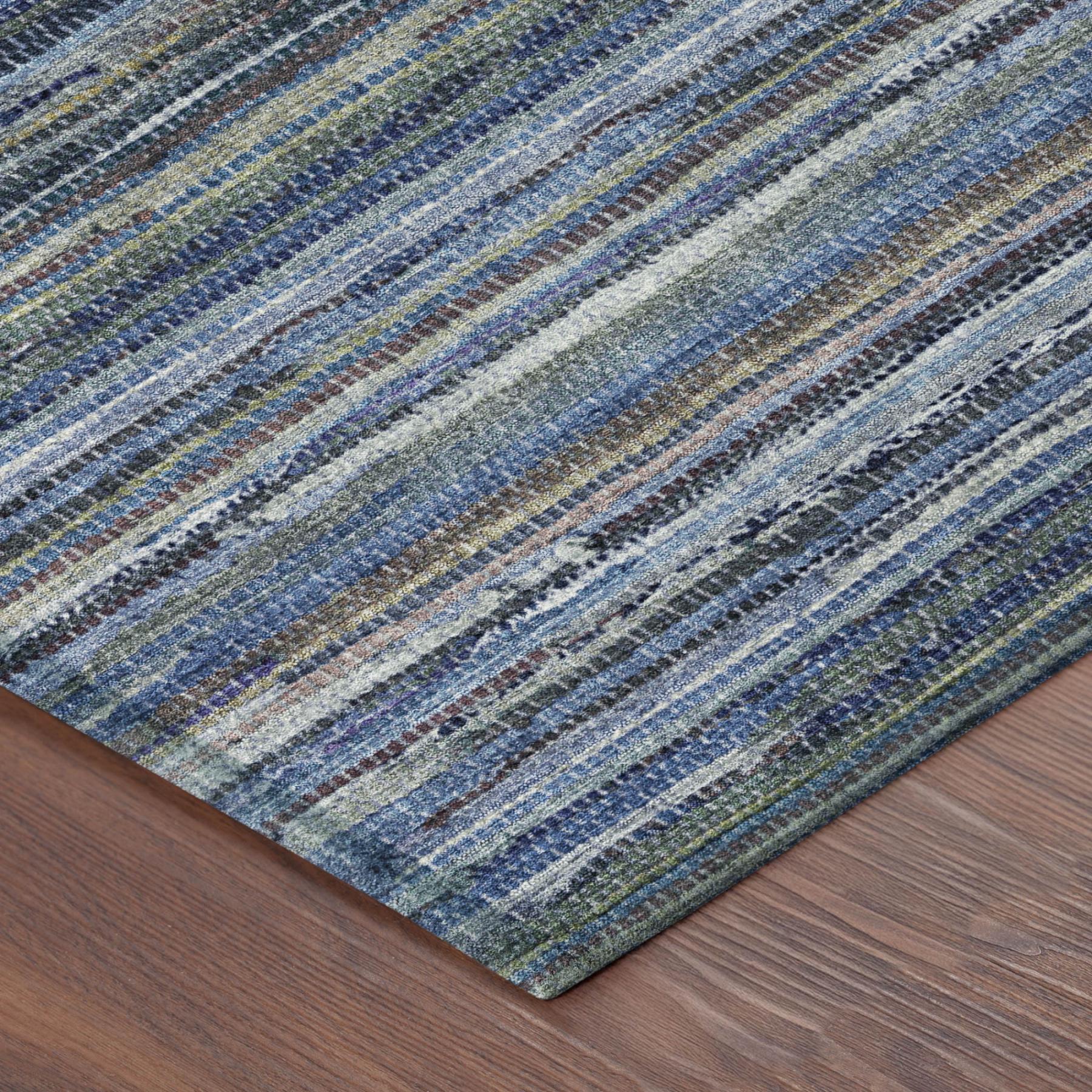 Blue and gray striped area rug corner view with textured woven surface.
