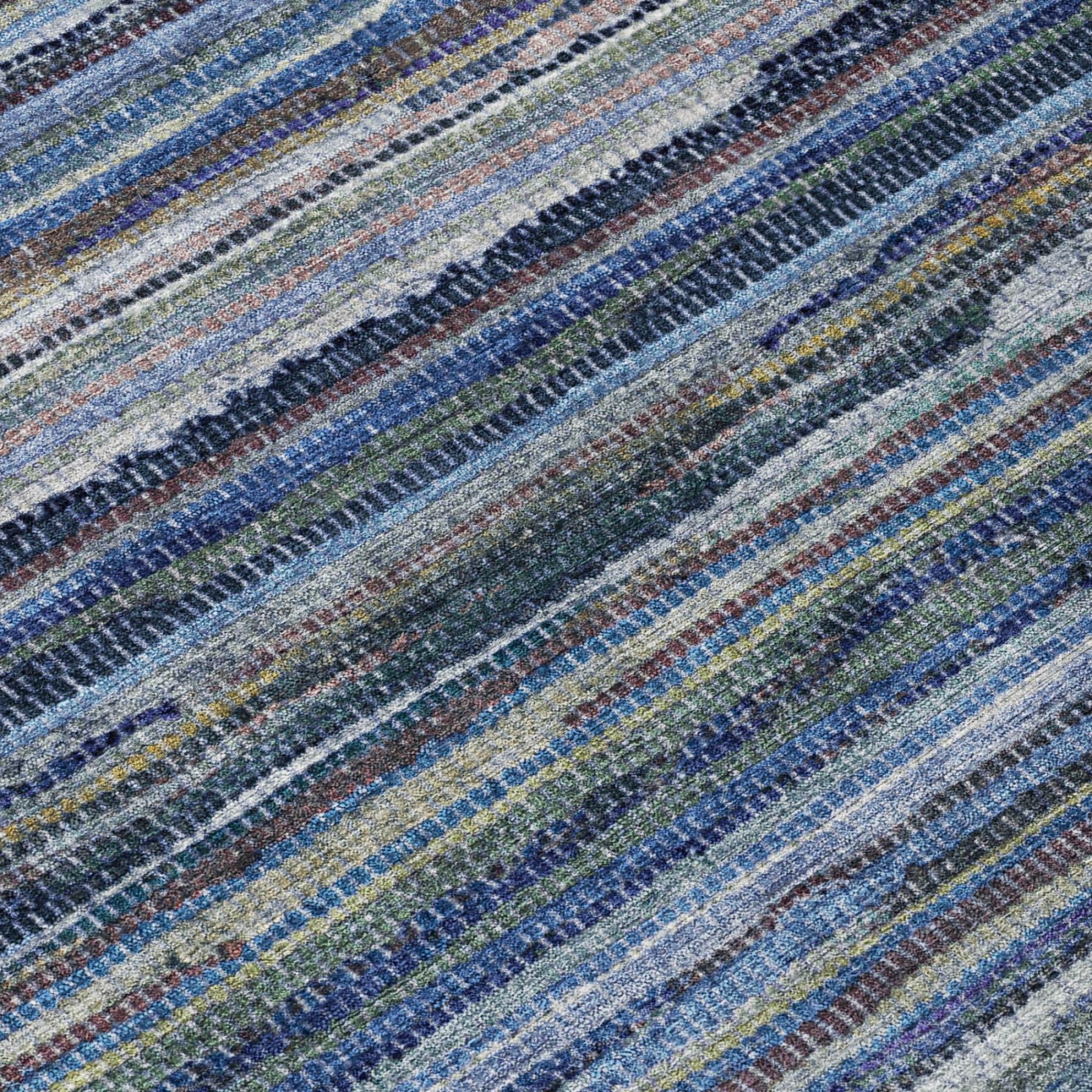 Close-up of blue and gray horizontal striped area rug with multicolor speckled threads.