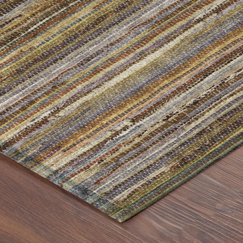 Round striped area rug in orange, brown, blue, and cream with textured, worn look