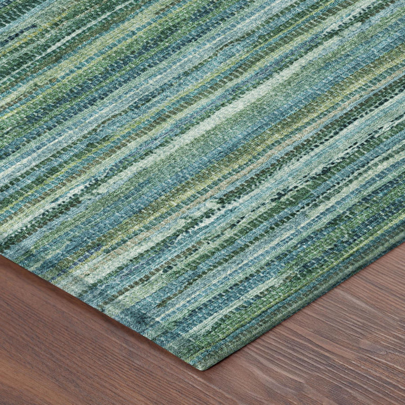 Striped indoor-outdoor area rug with teal blue, green, and cream horizontal lines.