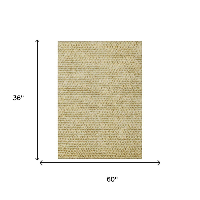 Area rug size shown: 60 in wide x 36 in long, wheat gold textured loop