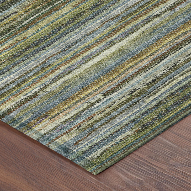 Striped area rug close-up with green, blue, tan, and dark brown woven bands
