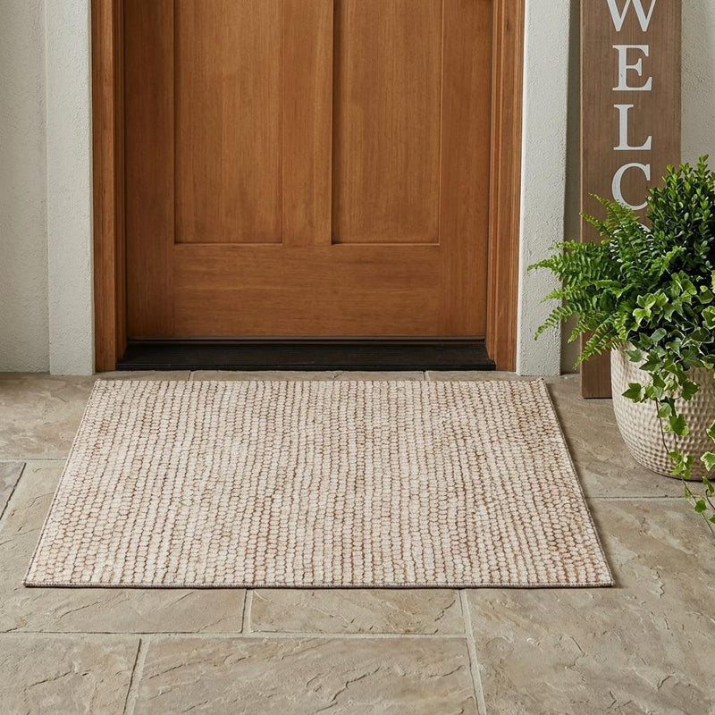 Beige area rug with textured loop pile, shown with a flat border