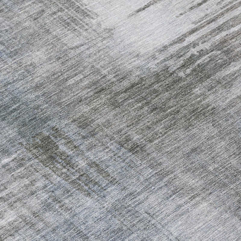 Close-up of abstract distressed rug surface in gray and blue-gray tones