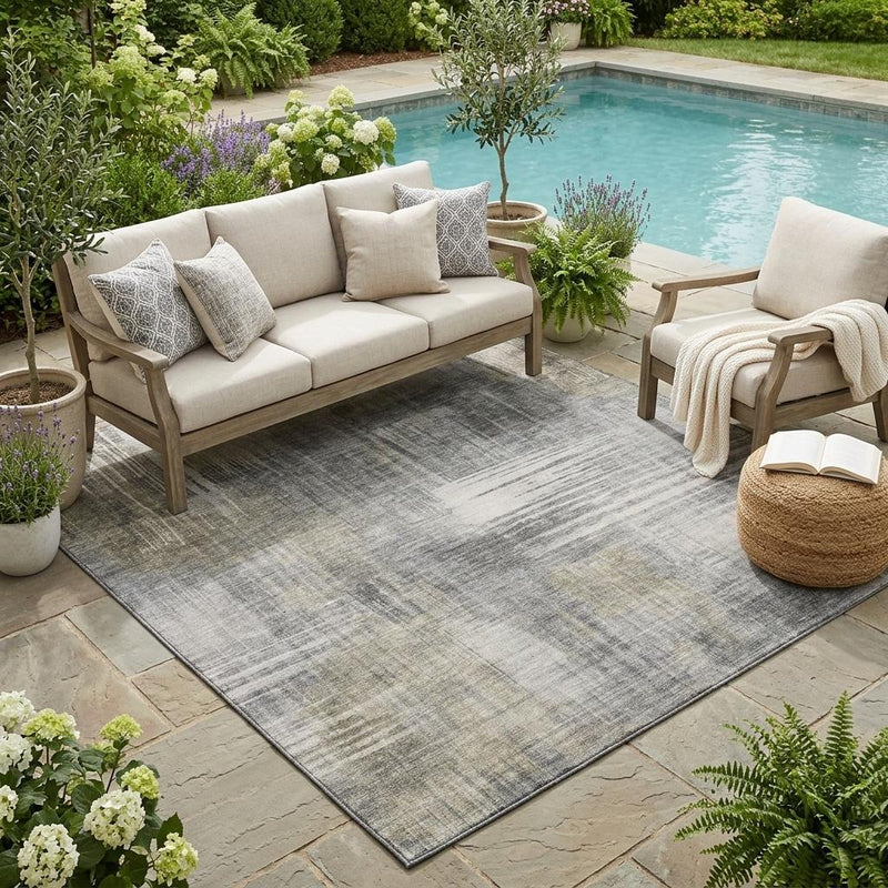 Pewter and gray abstract wash area rug on patio, distressed linear pattern