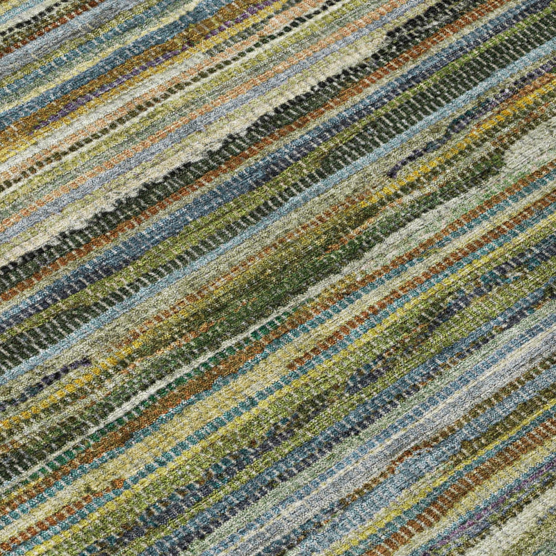 Round area rug close-up showing textured multicolor horizontal stripe pattern in blue and green