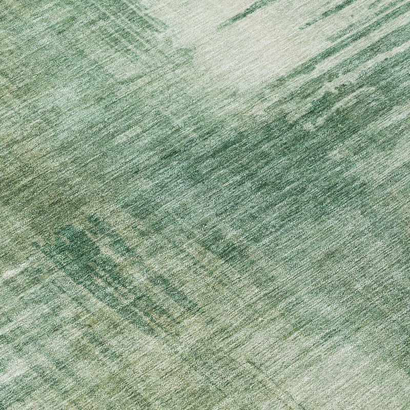 Abstract fern green area rug close-up with distressed streaked texture