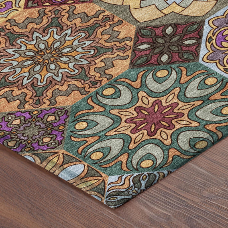 Patchwork area rug corner with teal and orange scrollwork and floral motifs