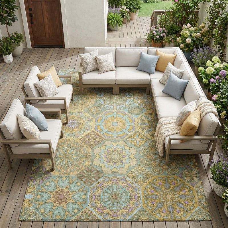 Patchwork indoor outdoor area rug with ornate floral medallion pattern in gold and green