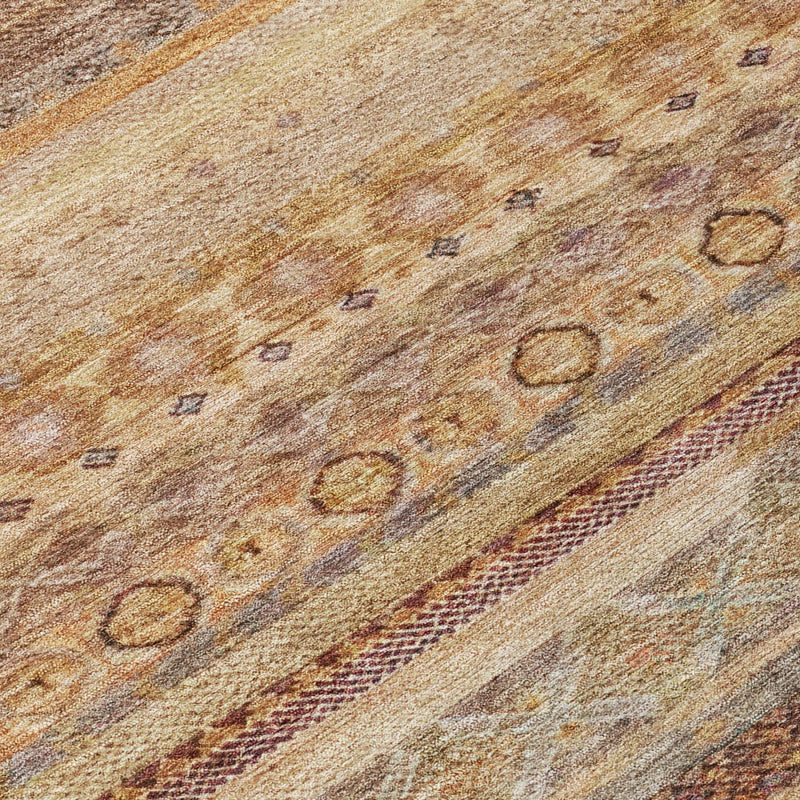 Close-up of woven area rug texture with orange-brown ground and dotted motifs