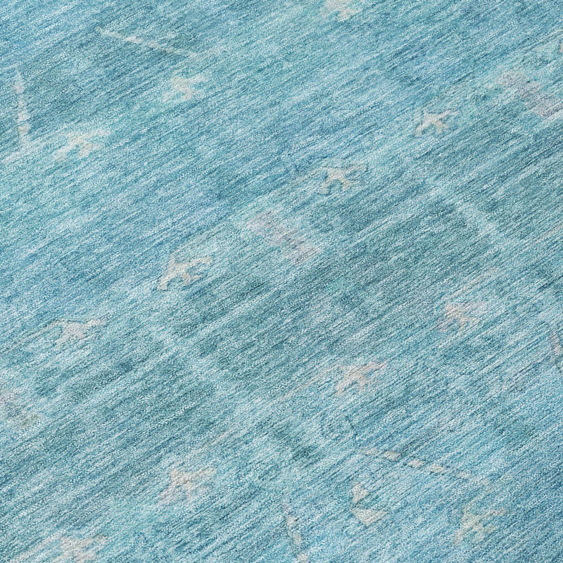 Blue textured surface of distressed tribal area rug, close-up