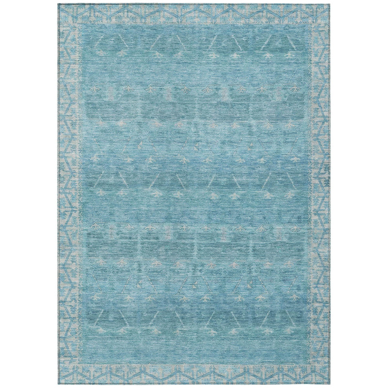 Rectangular blue and teal tribal distressed area rug with subtle border pattern