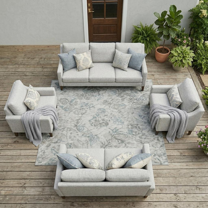 Floral area rug on indoor patio floor with light gray-green tones