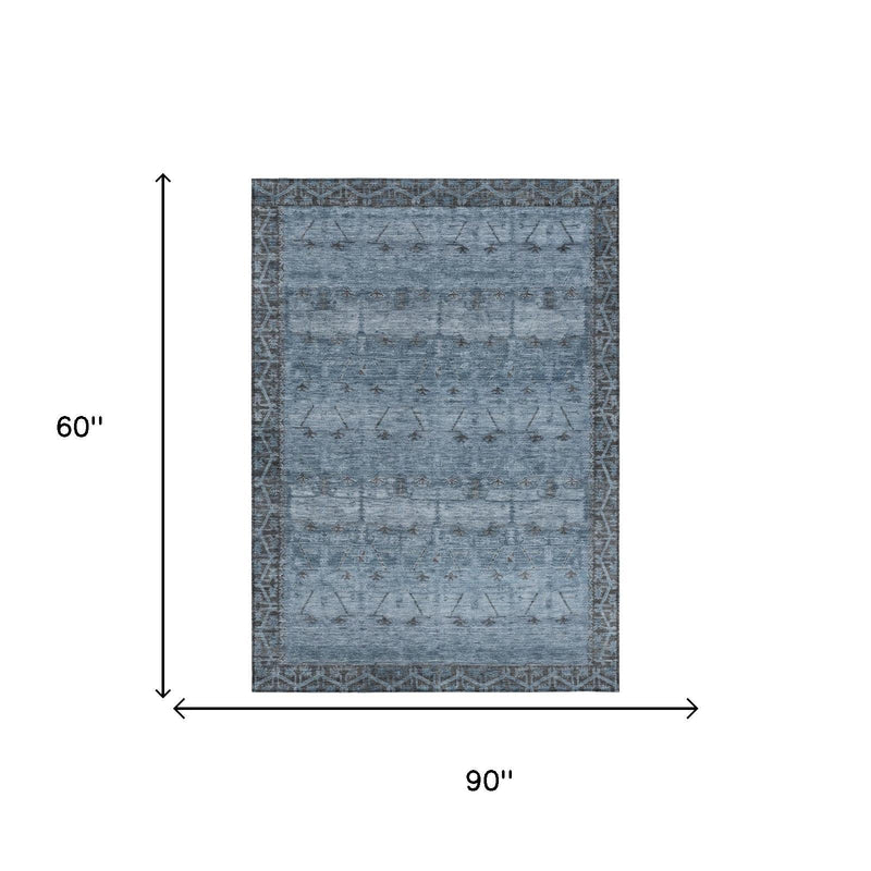 Blue and gray tribal area rug, 90 in by 60 in with distressed geometric design