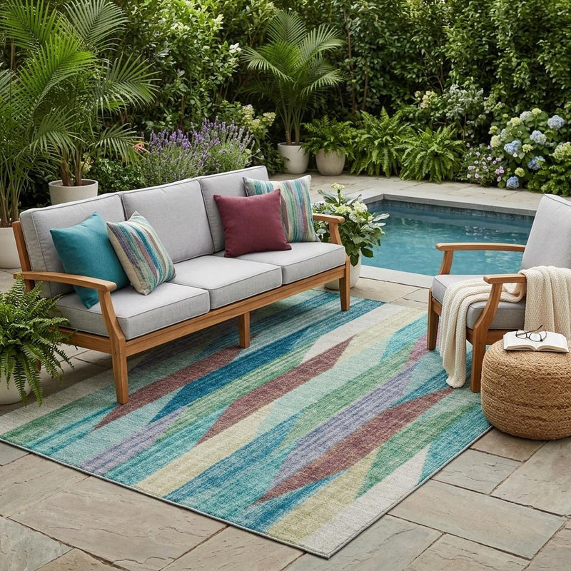 Striped area rug with teal, turquoise, beige, green, and brown vertical wave pattern on the floor