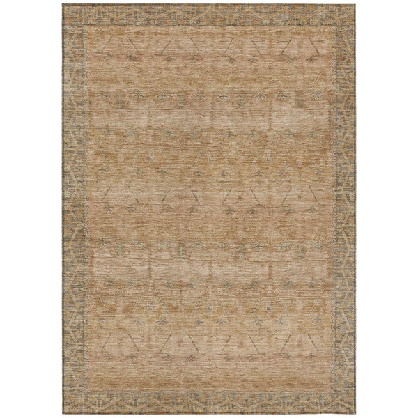 Tan indoor outdoor area rug with faded geometric tribal pattern and border edging