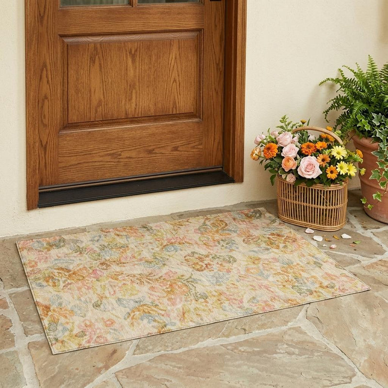 Peach and orange floral area rug with muted green and blue accents